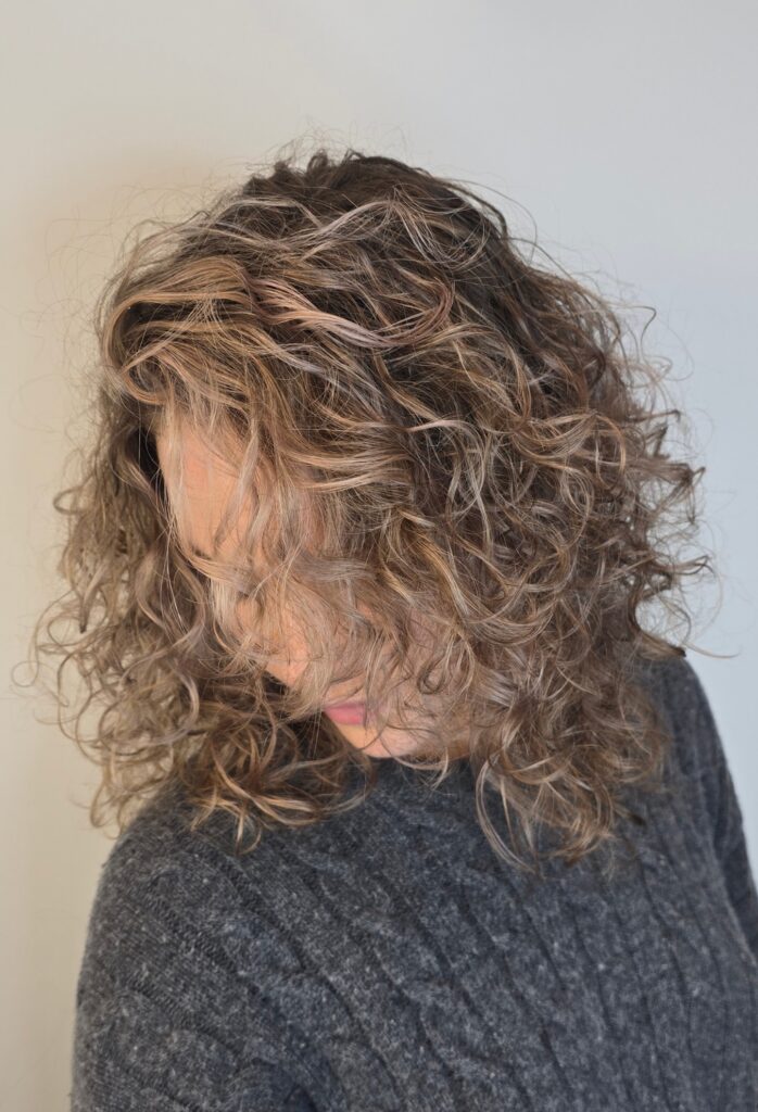 blonde balayage with highlights on curly hair - bam hair salon