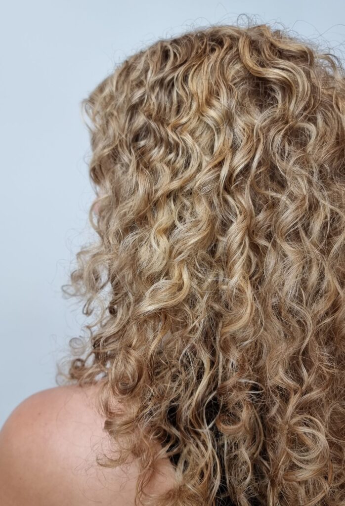 blonde highlights on curly hair - bam hair salon